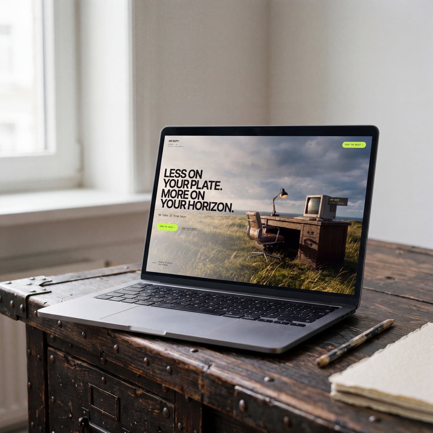 A laptop on the desk showing the OFF DUTY homepage.
